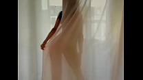 beautiful naked lady behind curtain